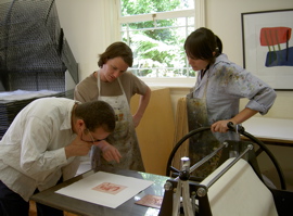 Artist and printers, proofing a print